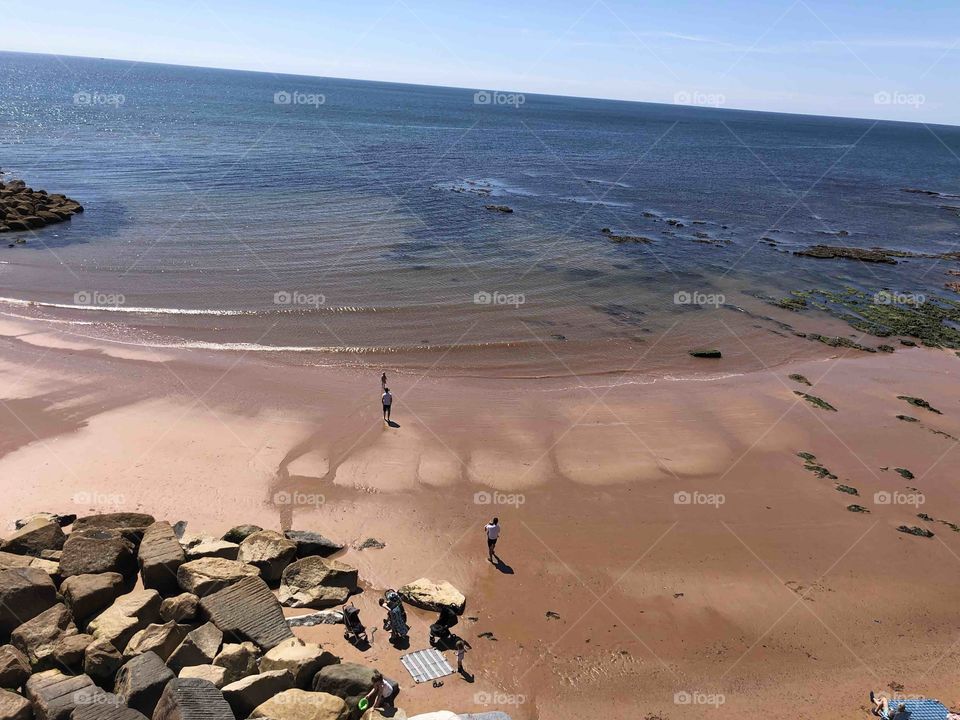 This beach photograph feature like an architects drawings, with the waves neatly sketched in size and with a set of giant wild animals teeth, coming out from the sand. This photo has a lot for one to treasure.