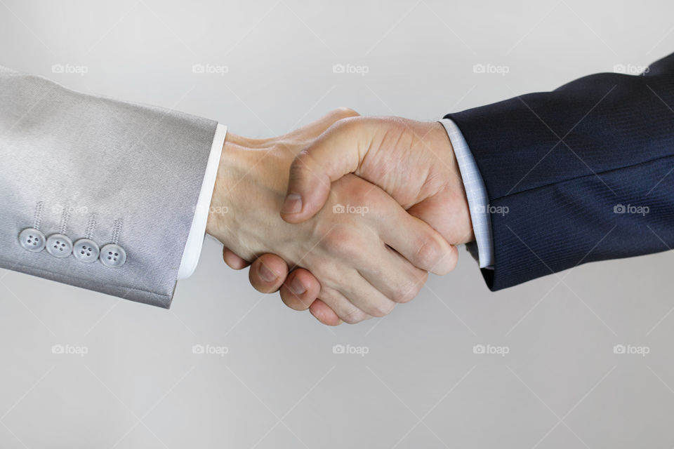 Handshake of two men in suits