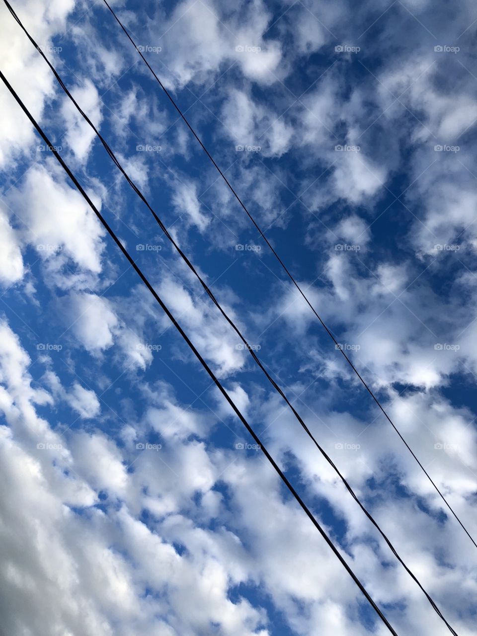Power line and clouds