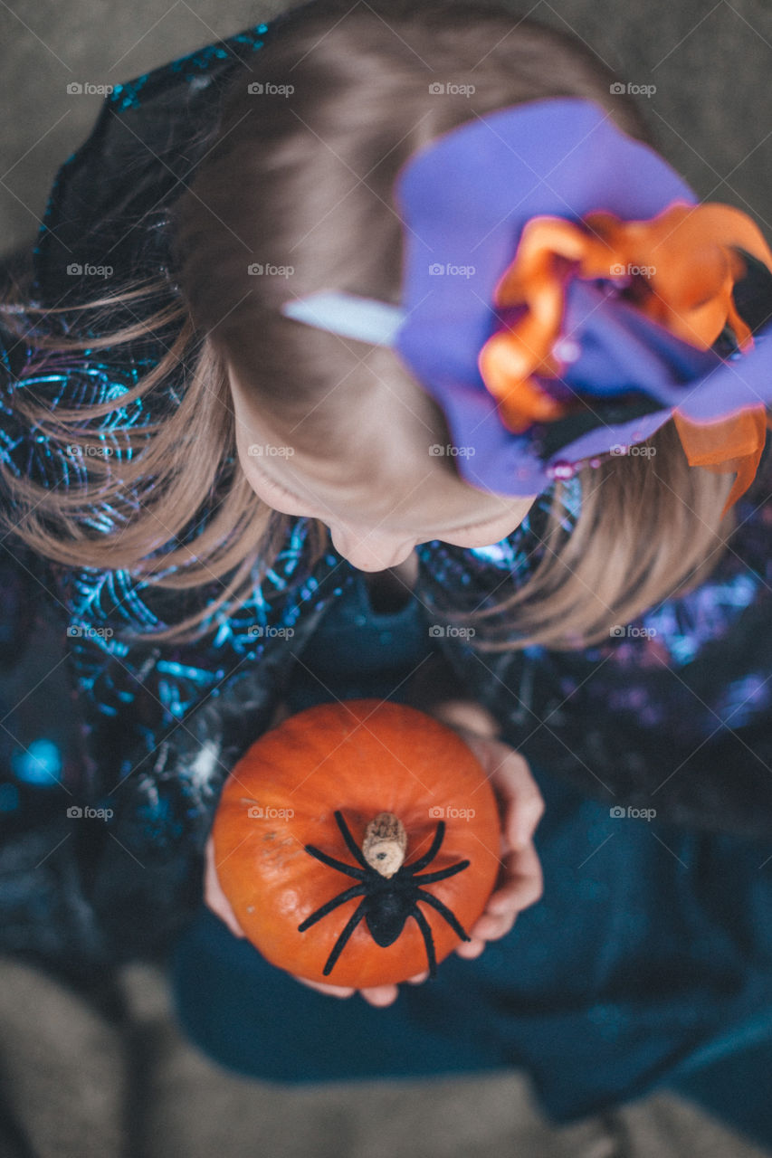 Girl and pumpkin for Halloween 