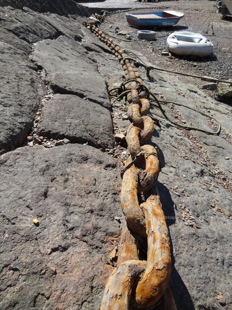 Mooring Chain. This old mooring chain has a few old items attached.