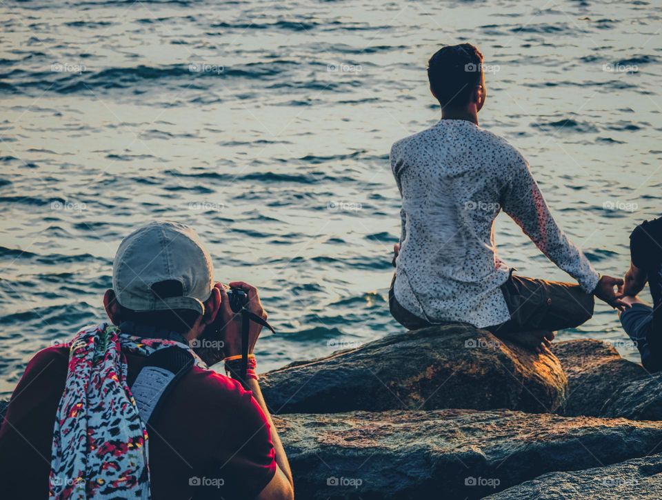 A man mediating in the sea shore 