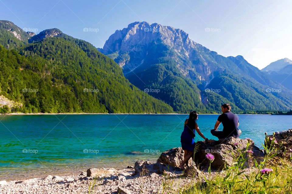 Couple enjoying at lakeside 