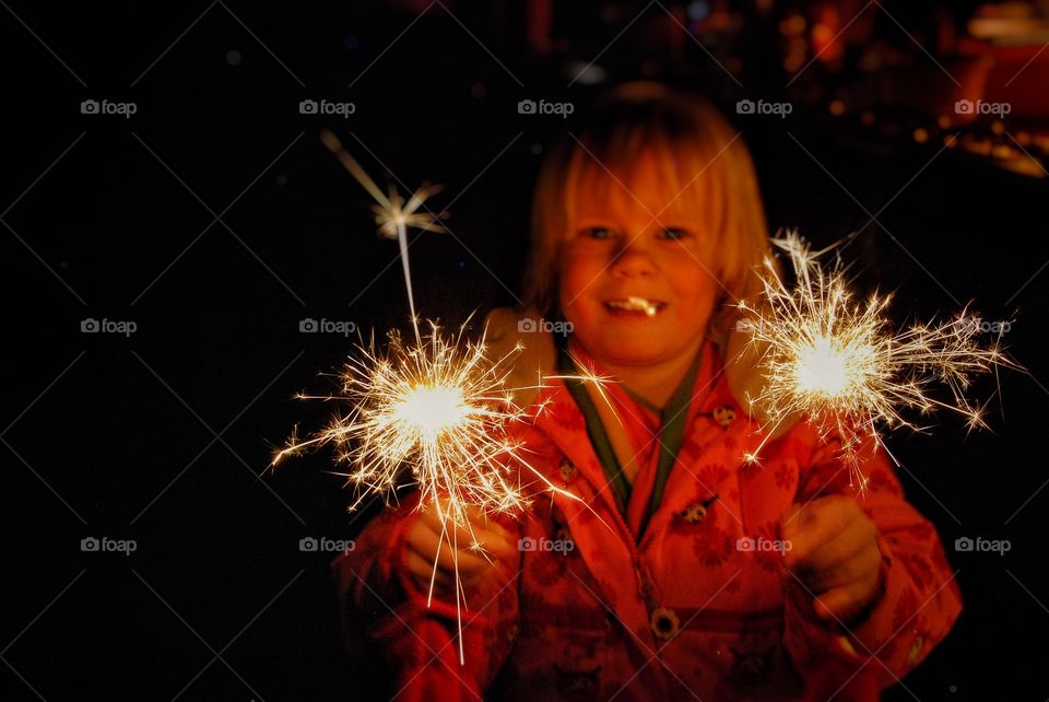 Child having fun with sparklers