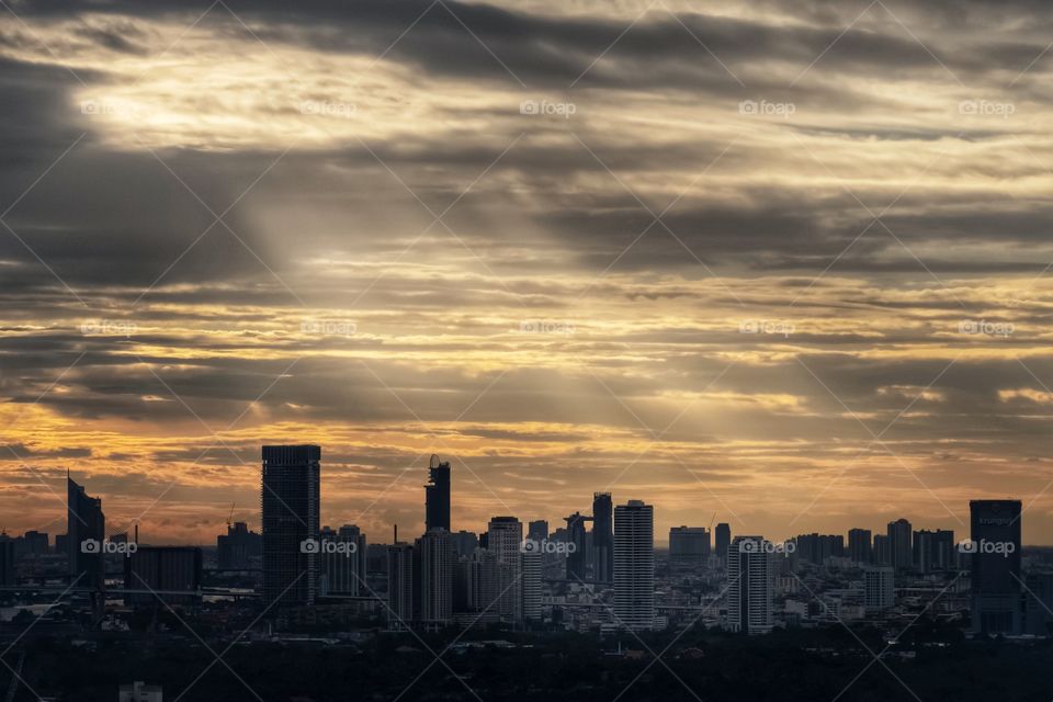 Sun light beam shade on skyscraper in Bangkok Thailand