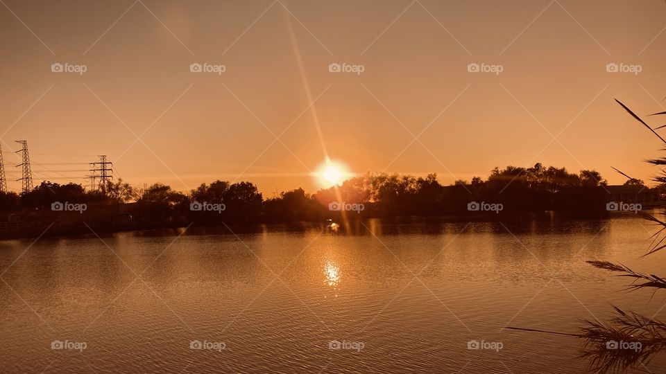 Evening sunset, evening Glow, Calm Lake Waters, spectacular setting for Sunset. 