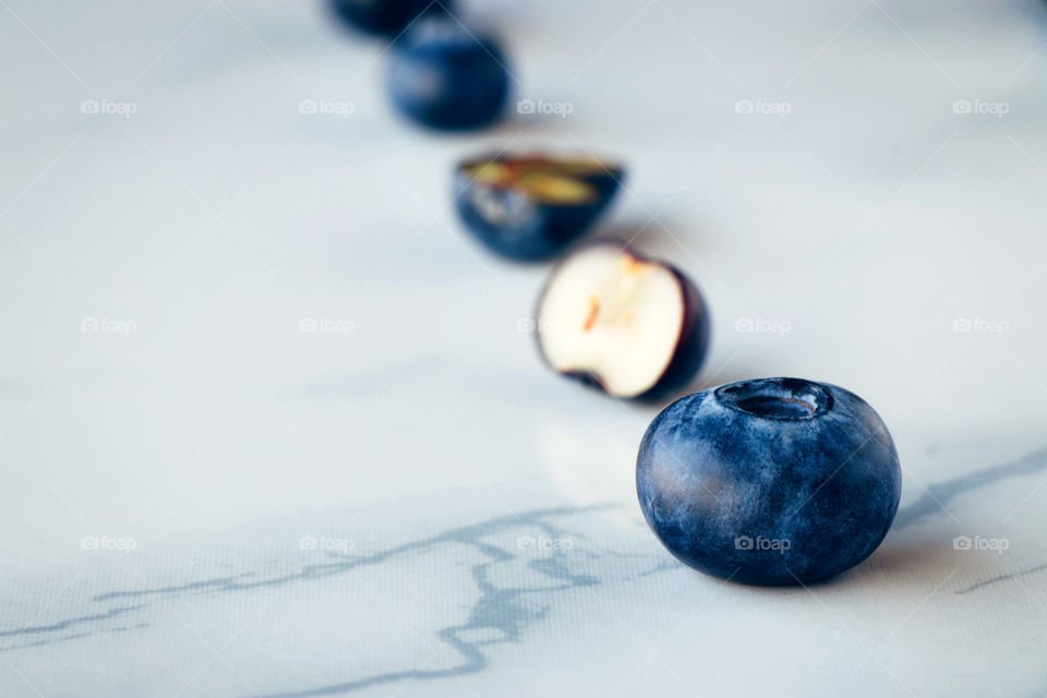 Fresh organic blueberries on a marble background 