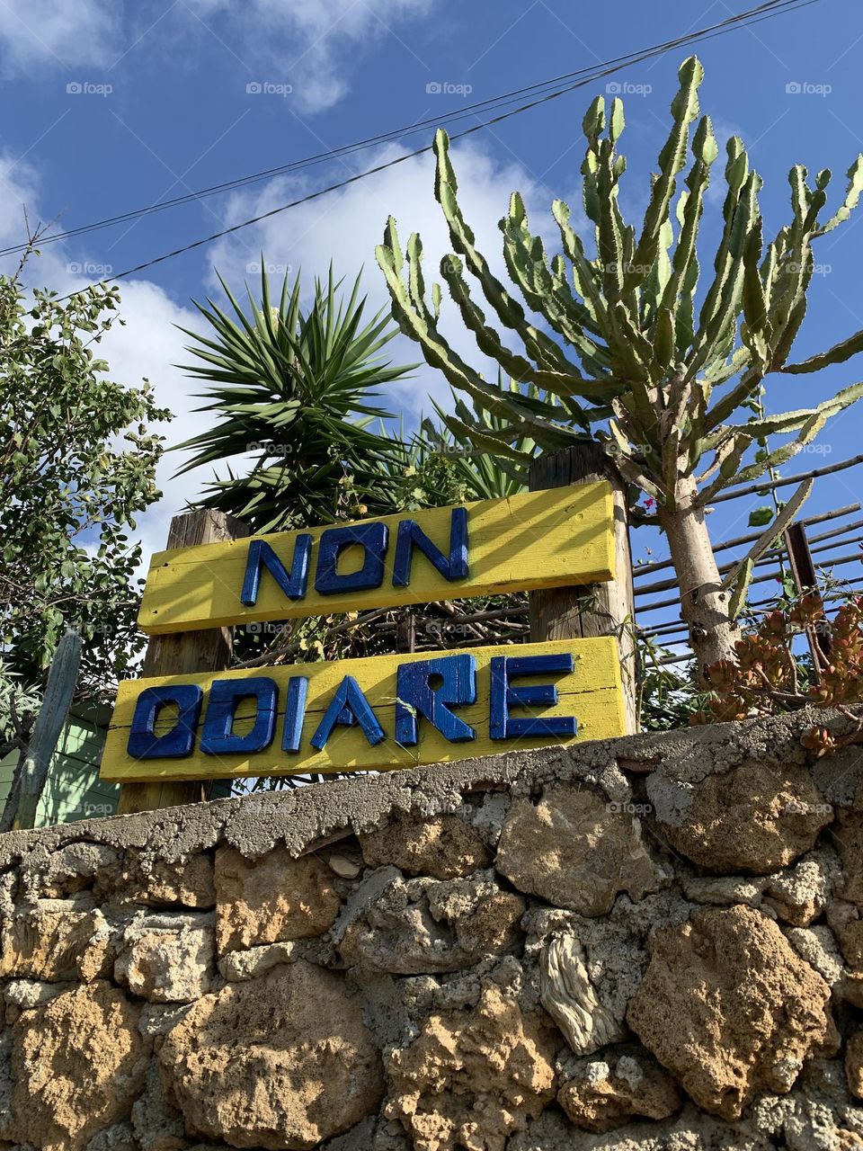 a wooden sign sent passers-by to "don't hate"