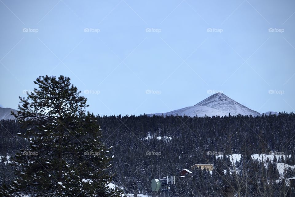 View of the lonely mountain across the valley on a cold winter day.