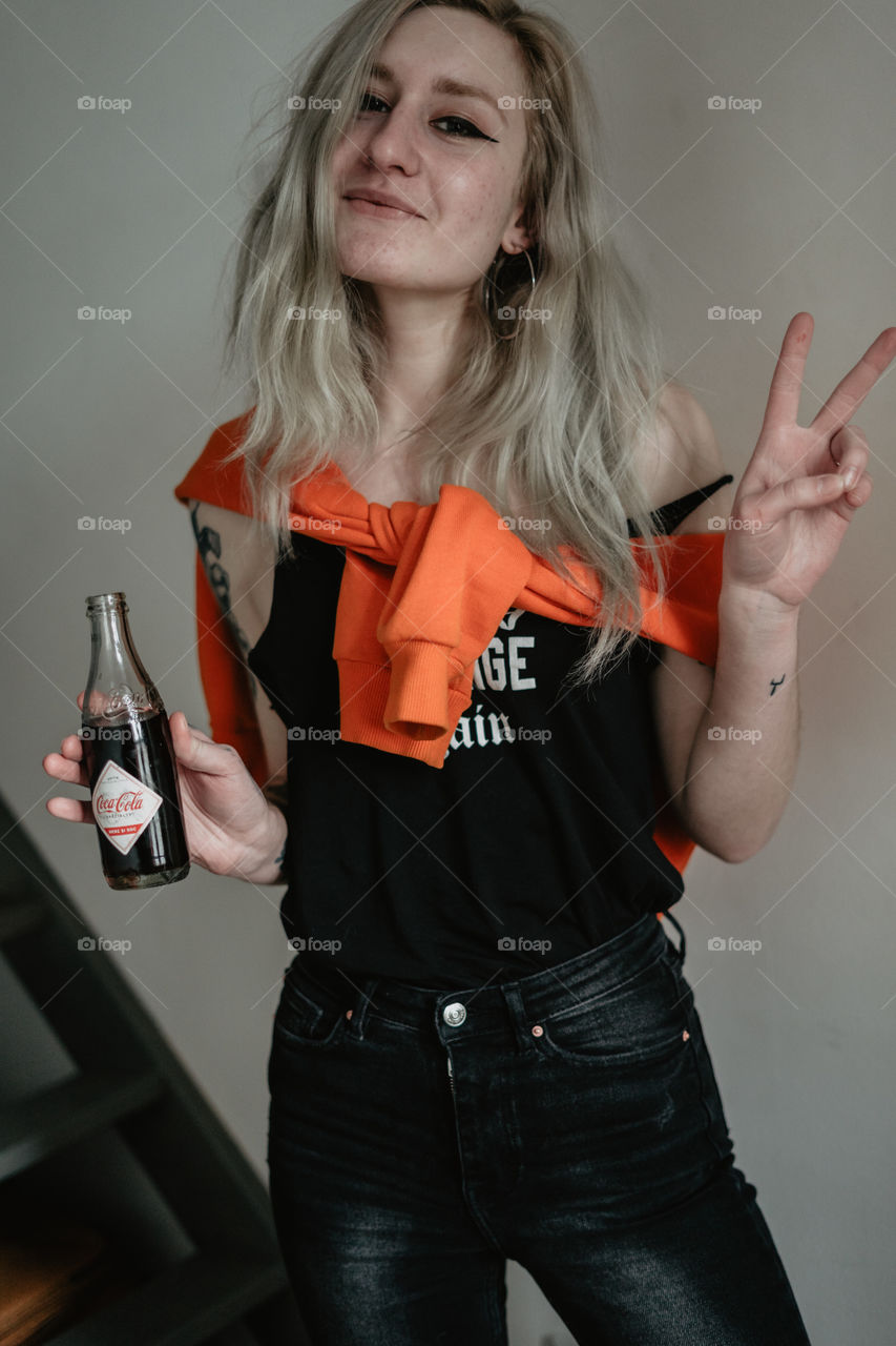 girl having fun with coca cola 