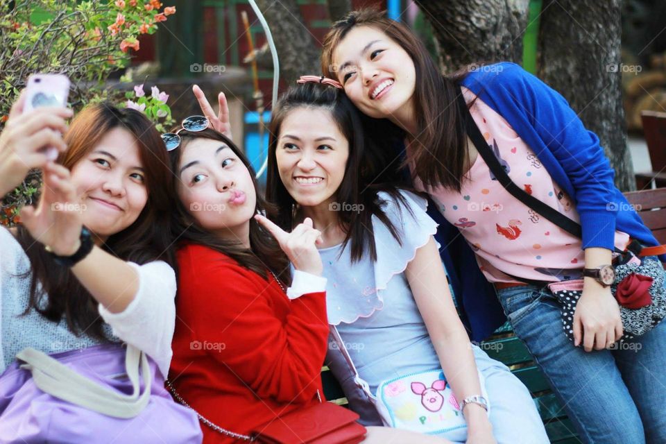 Smiley girls chilling out at Pattaya community mall