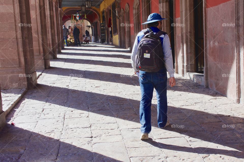 Man walking in corridor
