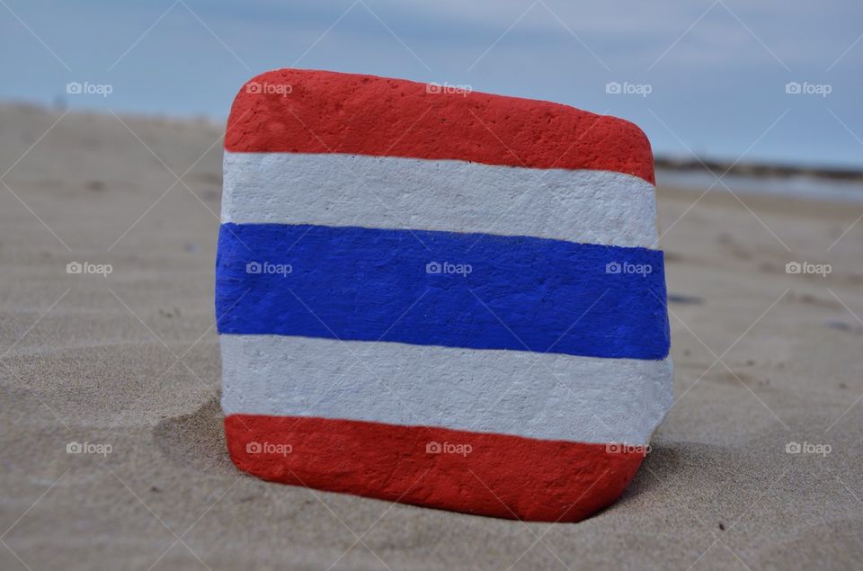 Kingdom of Thailand flag on a stone