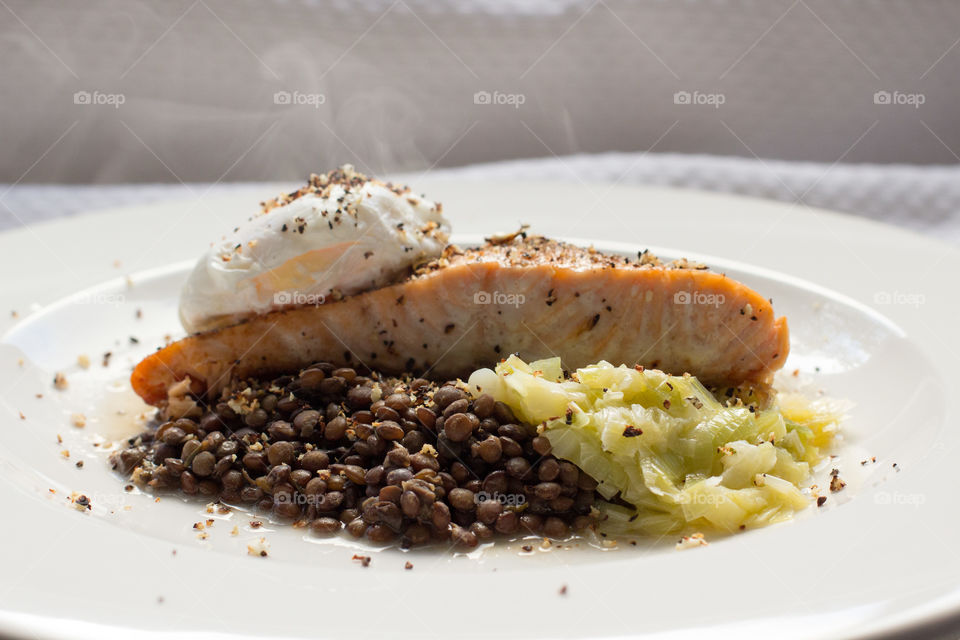 Baked salmon with puy lentils, leeks and poached egg