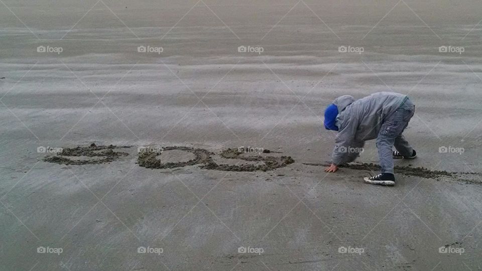 sos. playing in sand