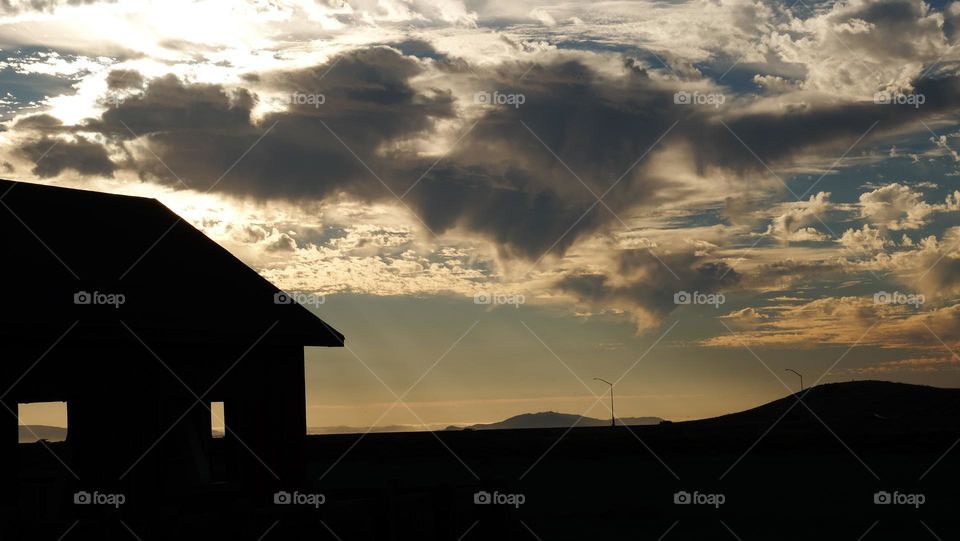 Clouds above a barn.