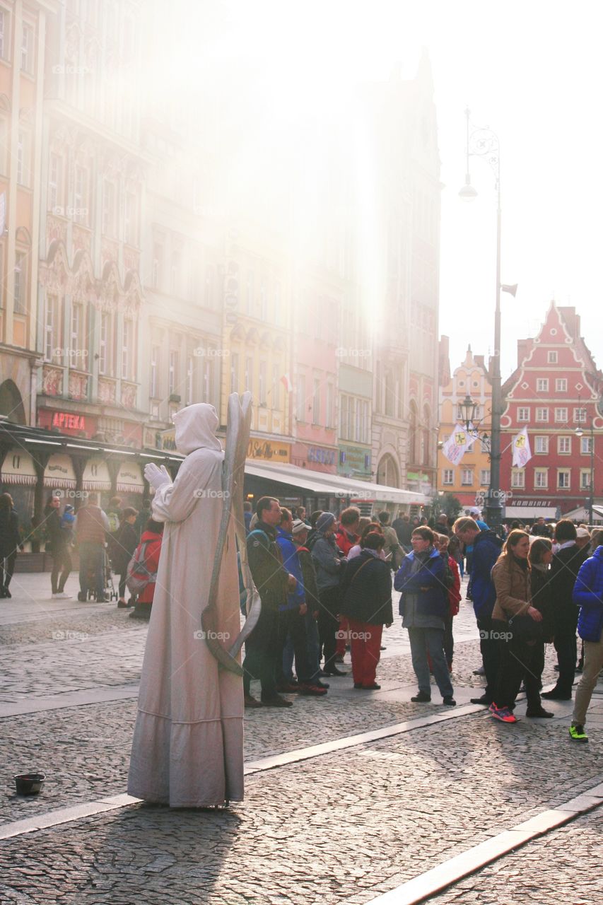 This angel mime looks as if he descended from a sky!