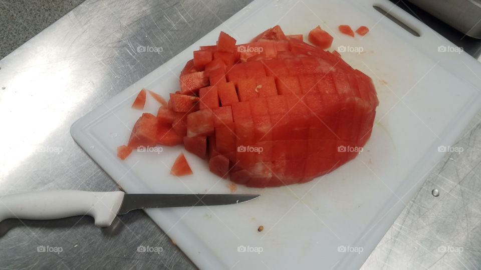 chopping watermelon