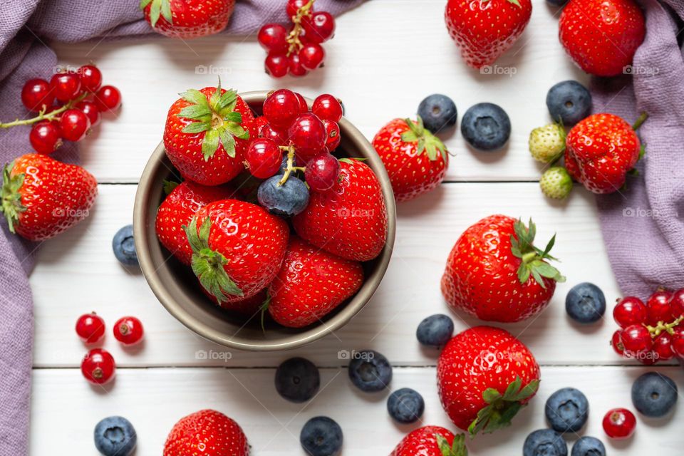 summer fruits, strawberries, currants and blueberries