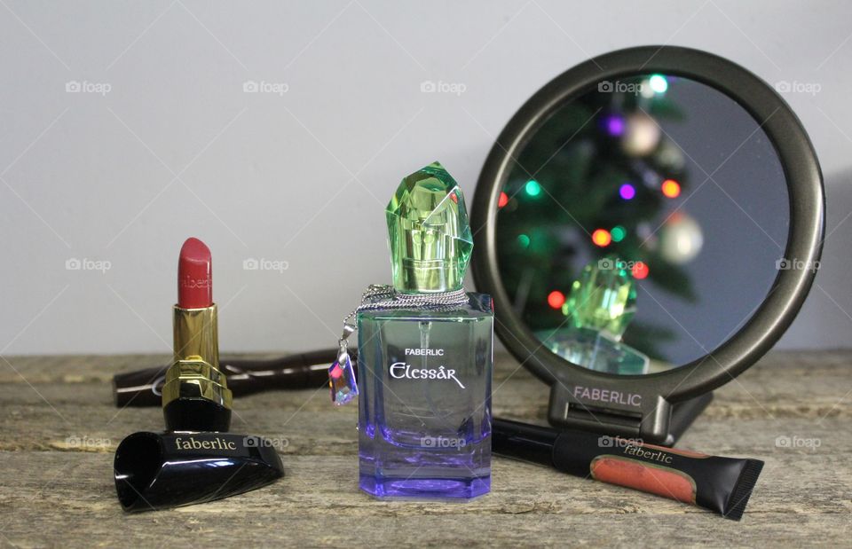 Perfume Elessâr, mirror, lipstick, lipgloss and mascara from Faberlic.