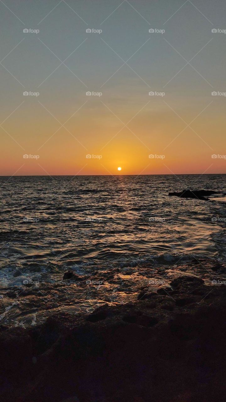 Proof that few things in life are as beautiful as the sun setting over the beach.