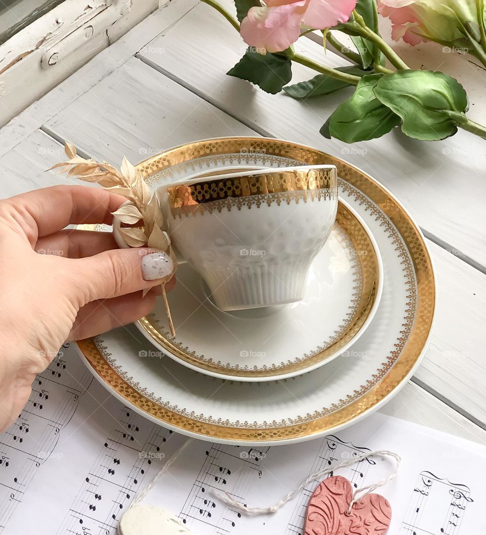 Porcelain antique tea trio with beautiful relief pattern and gilded