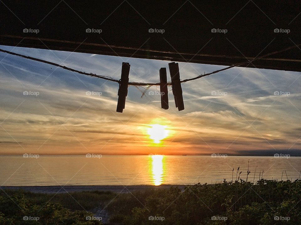 Clothes pins in sunset