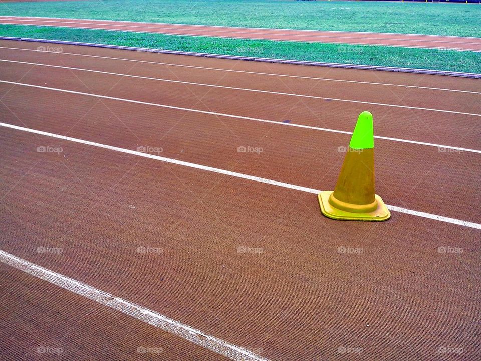 track and field oval and safety cone