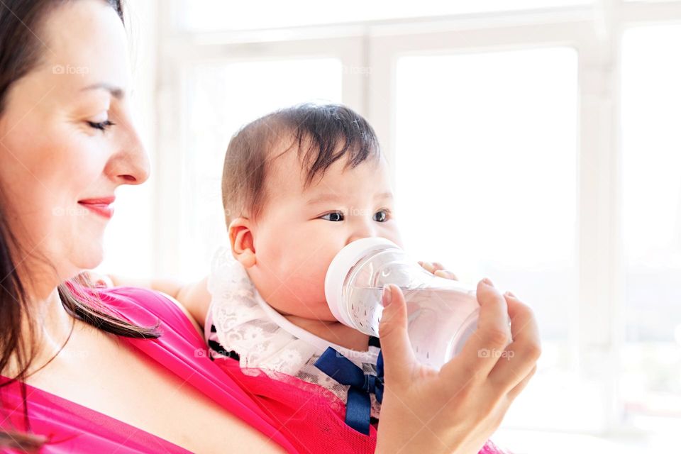 mother feeding baby