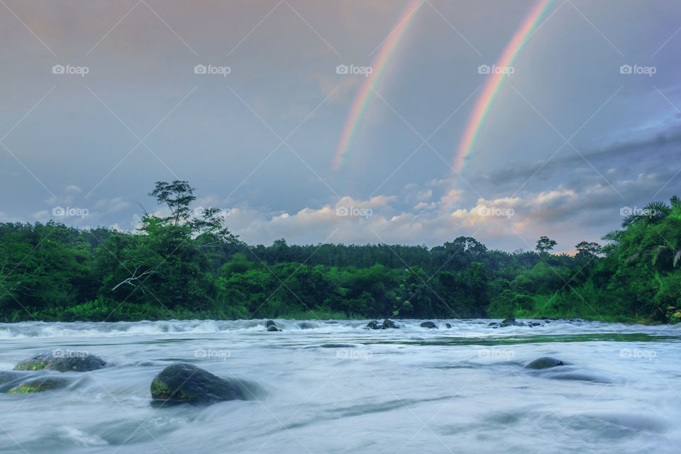 double rainbow at river