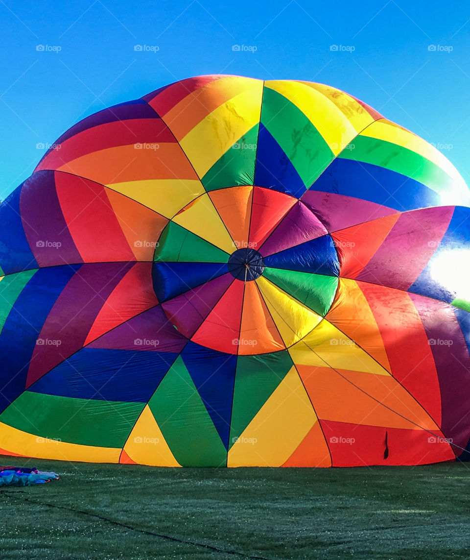 On its way up!  Stowe balloon festival in Vermont happens every July.  This was the morning lift off - the balloons were just starting to fill up 