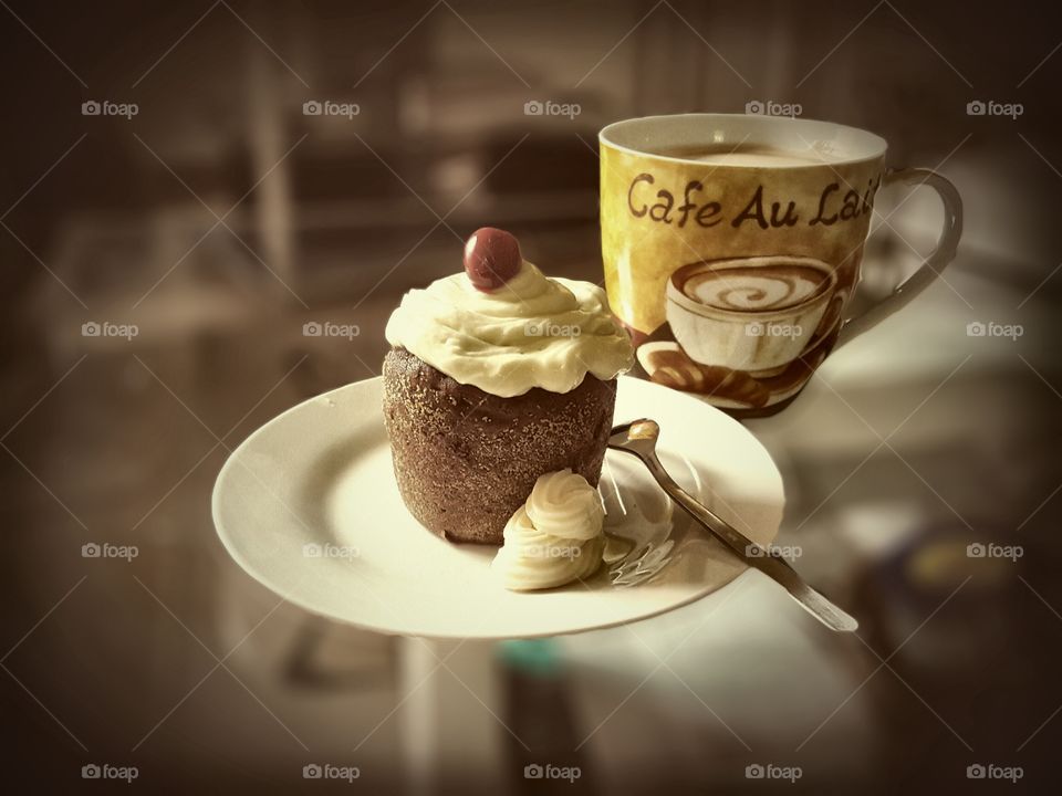 a tasty combination. homemade cupcake and a cup of coffee