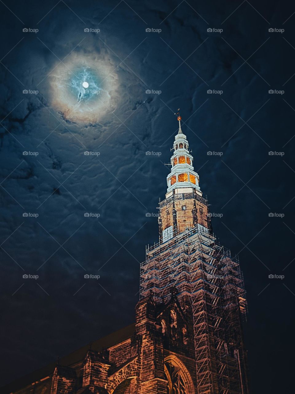 Old gothic cathedral at night, dark blue sky and full moon in the background, nice old architecture, silent night, no people, Poland, Świdnica 