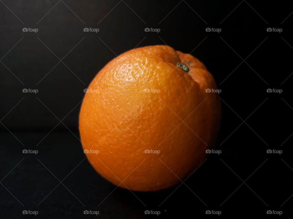 Orange on the black background