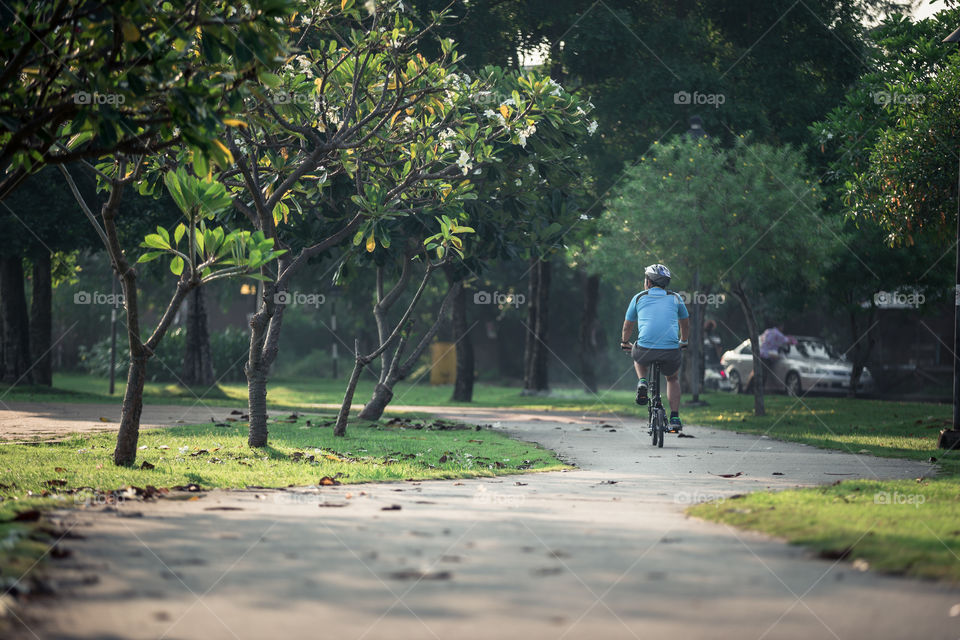 Man riding a bicycle in the park 