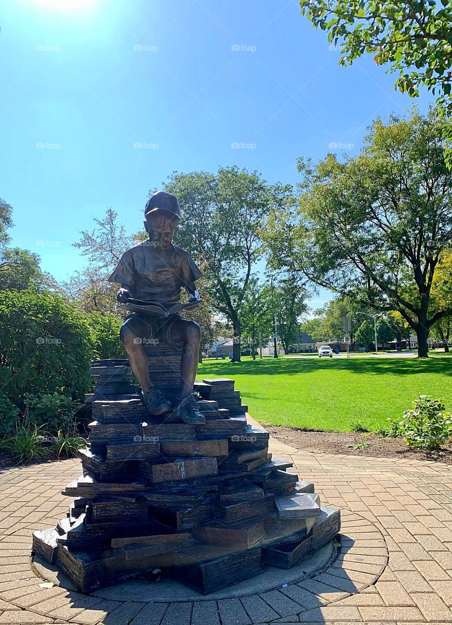 Monument from metal - a Boy with Books 