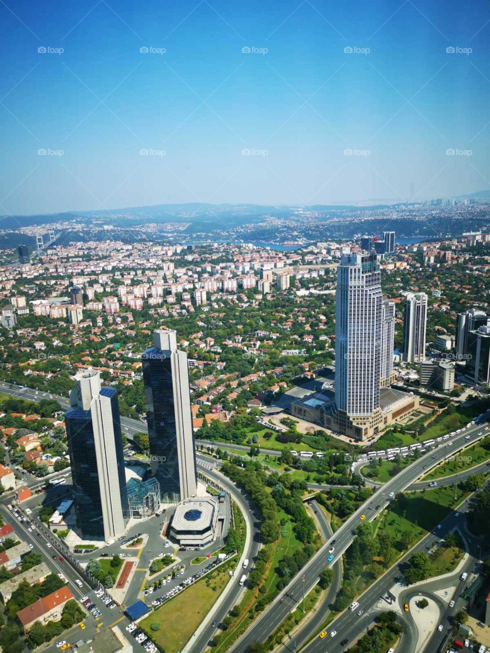 A beautiful view from the highest skyscraper in Istanbul city to the traffic, skyscrapers, river, nature and other.