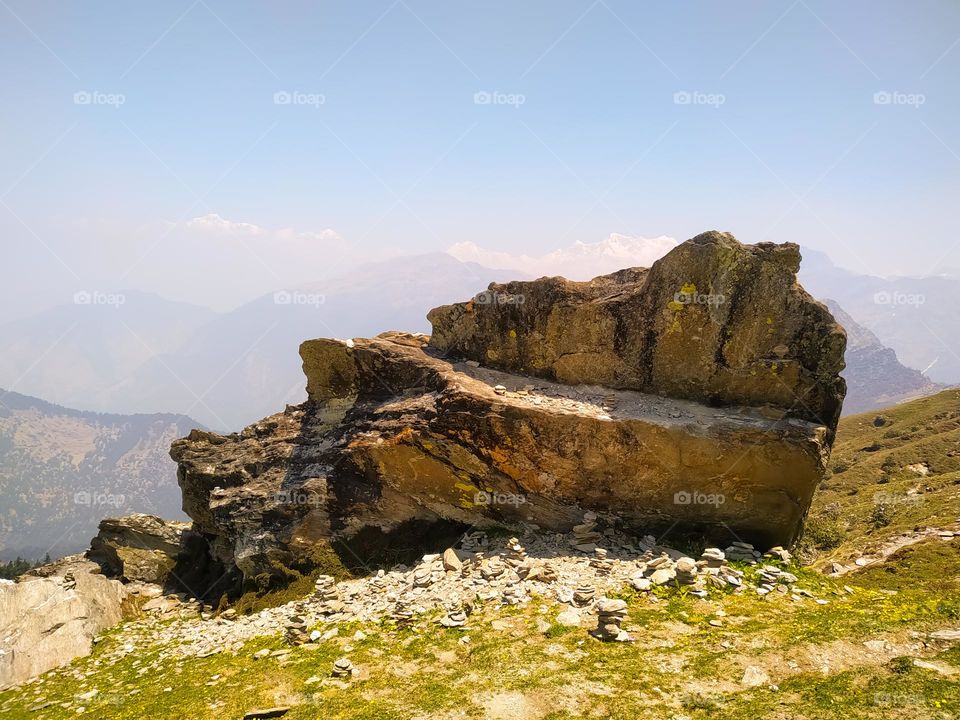 A amazing view of big rock in the mountains with sky