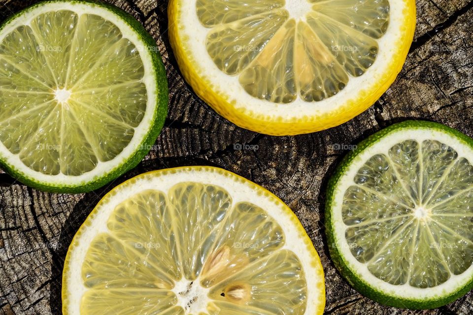 Lemons And Limes On A Log, Portrait Of Lemons And Limes, Fruit Details, Food Photography 
