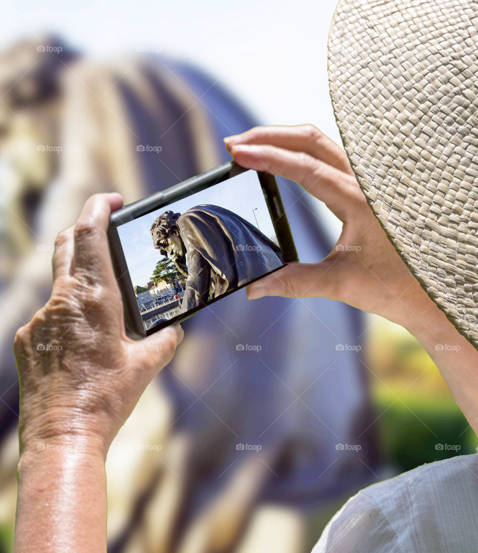 Phone. Camera phone Tourist taking a picture with a smartphone cell phone mobile phone camera 