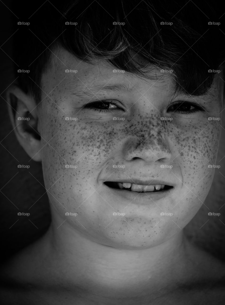 Portrait of a boy with freckled face
