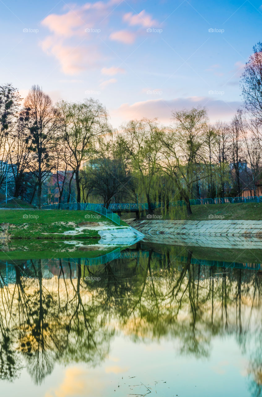 city park with lake in the spring season