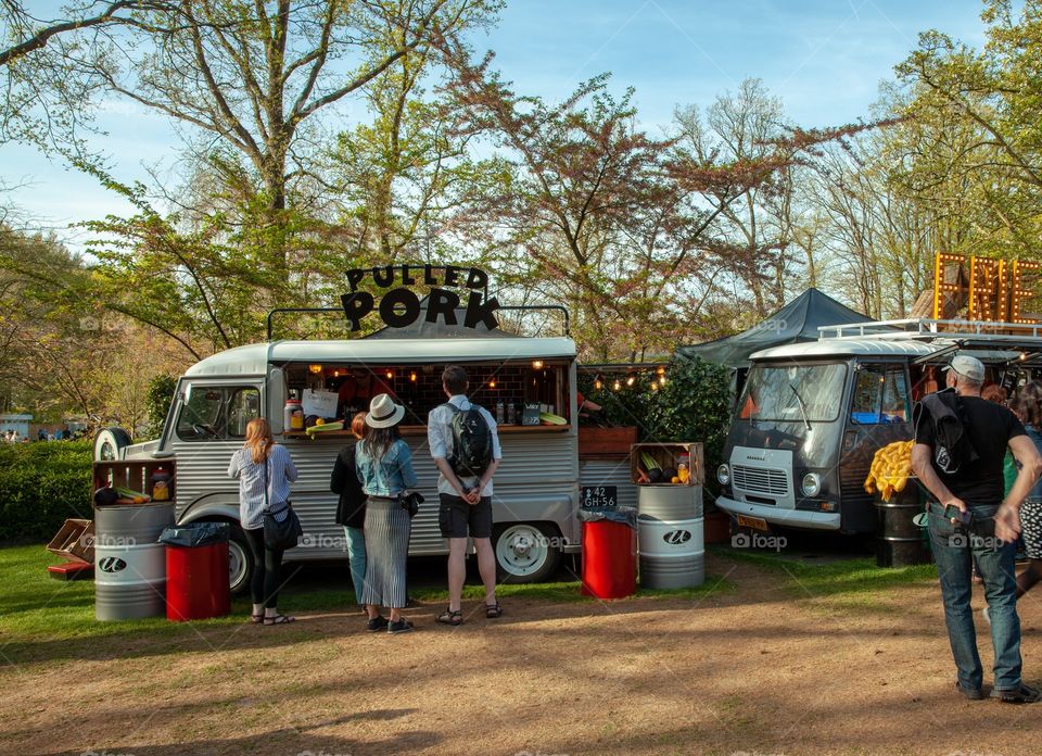 People meet at the Street Food Cars 