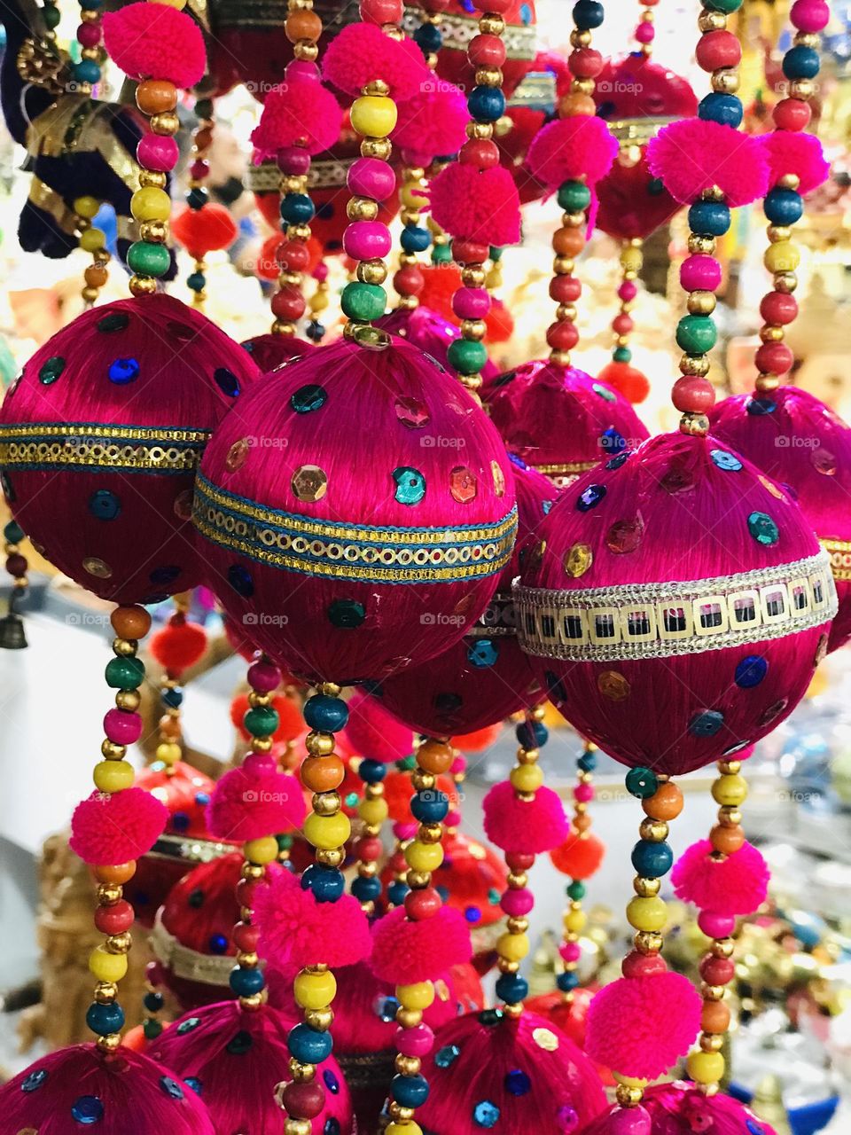 Decorative Indian hanging balls Made with threads and beads.