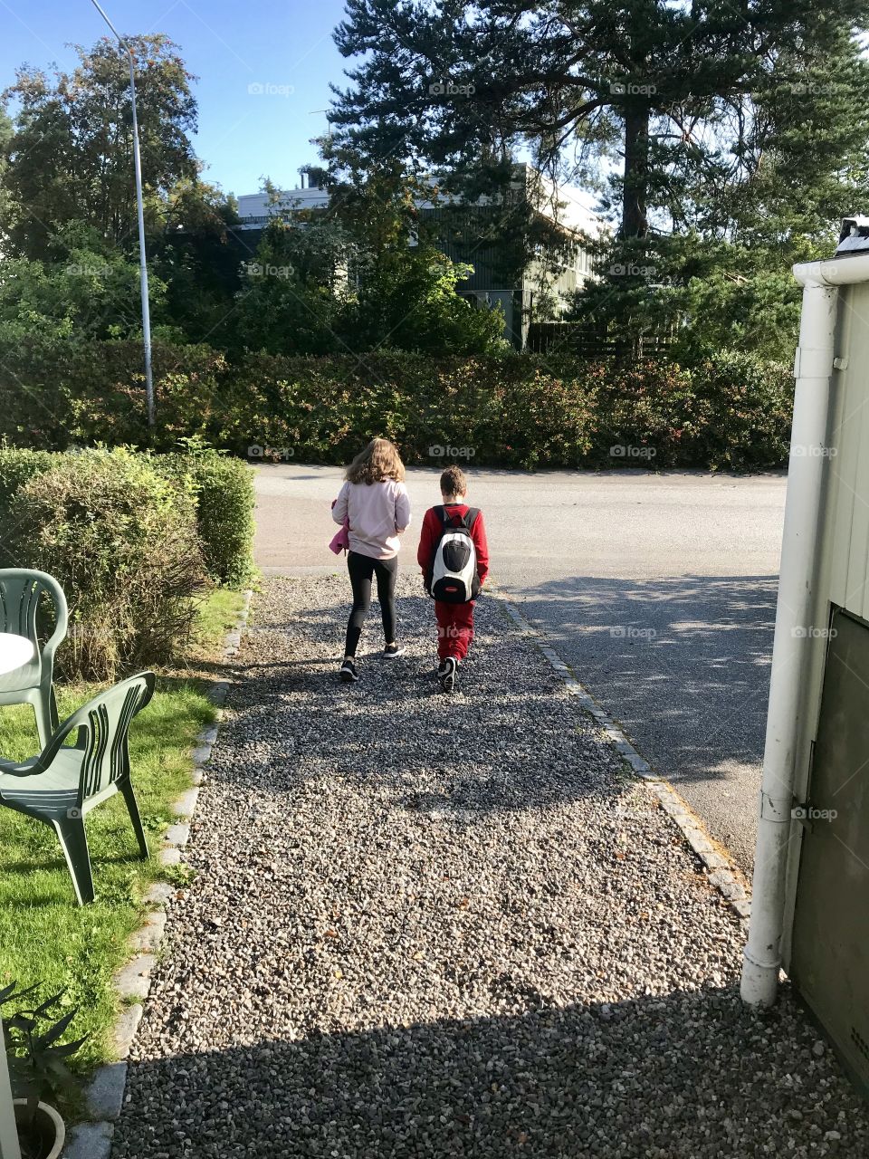 Brother and sister going to school