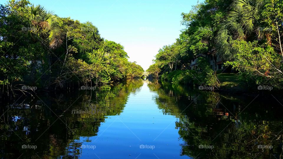 A Light at the End of the Tunnel . Paddleboarding off the golf course in South Florida