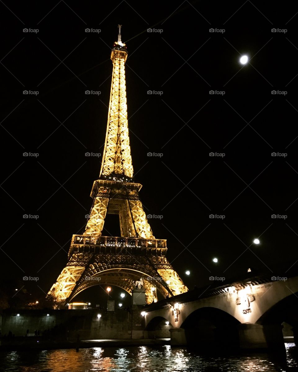 Eiffel Tower lit up at night in Paris, France