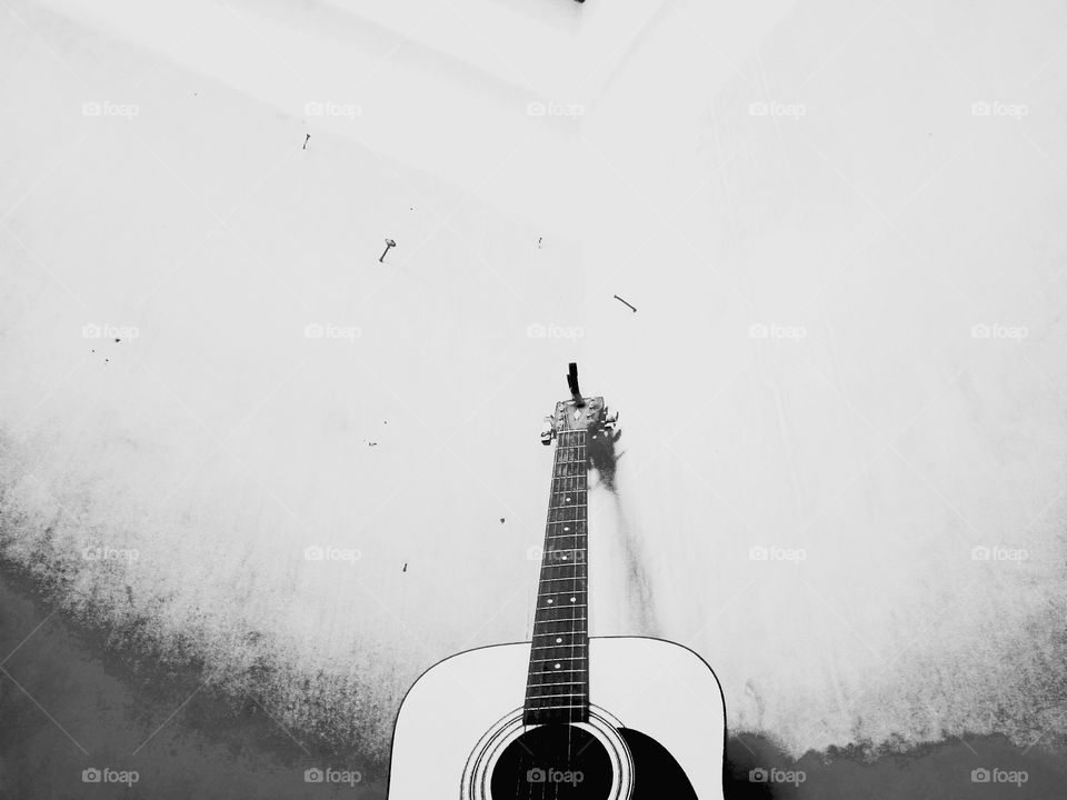 a photo of a guitar in the morning with reflected sunlight