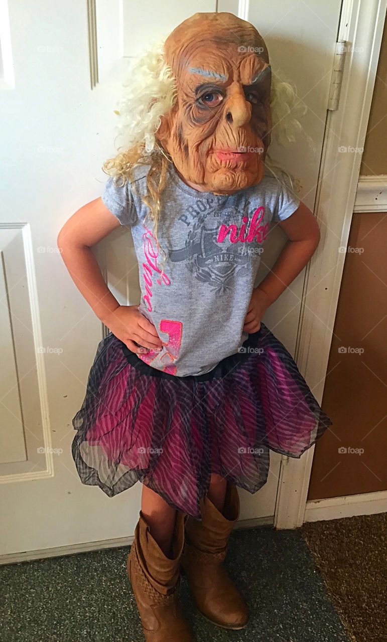 Mildred. Four year old girl wearing a mask of an old lady that she's named, Mildred. 