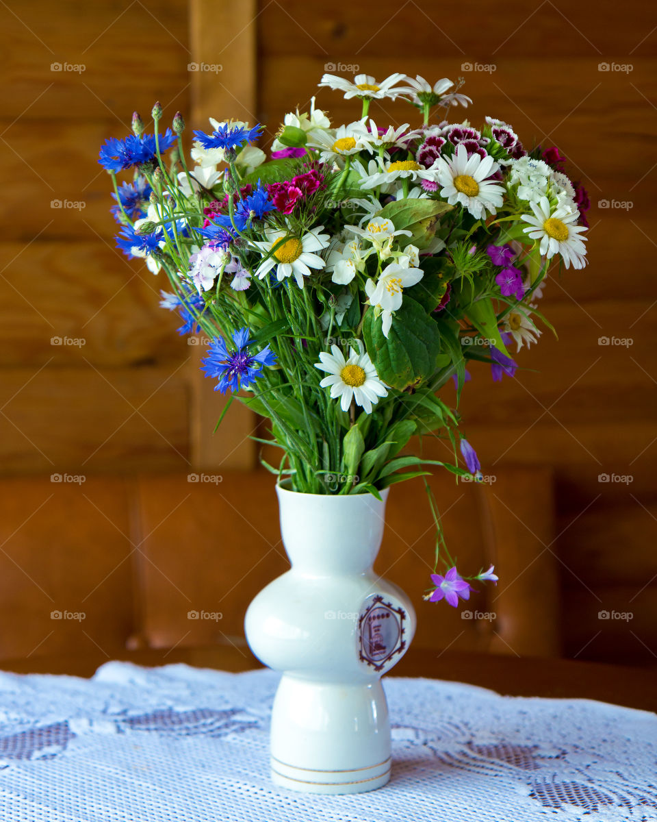 a bouquet of flowers. daisies, cornflowers, carnations